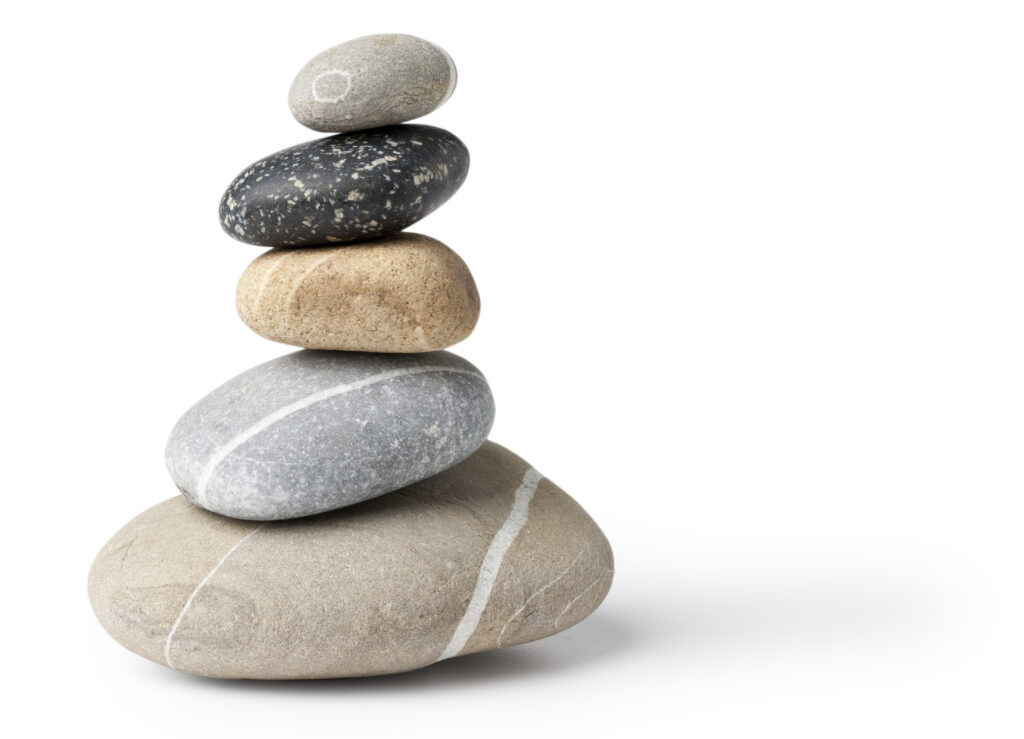 Balanced stone pile - Isolated on white with original shadows in high resolution and natural colors