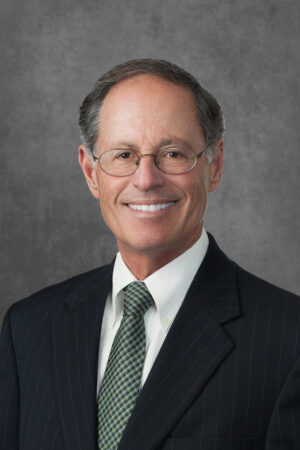 A professional headshot of Andrew Garb.