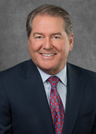 A professional headshot of William Ramsey.