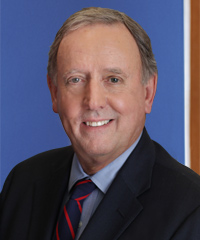 A professional headshot of James Langdon.