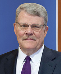 A professional headshot of James Parks.