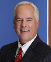 A professional headshot of Tim McCarthy.