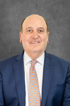 A professional headshot of Peter J Zarifes.