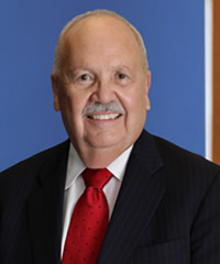 A professional headshot of Ronald Zideck.